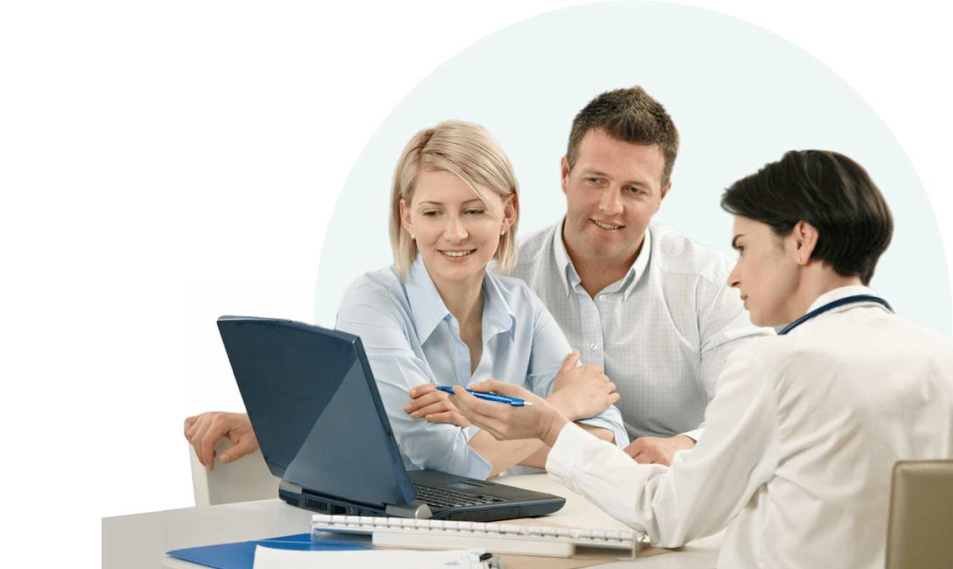 Doctors looking at laptop while sitting